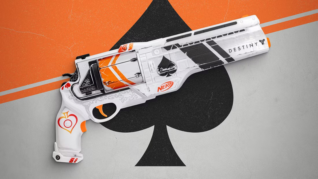 a-white-ornage-and-black-handgun-in-front-of-a-large-ace-of-spades